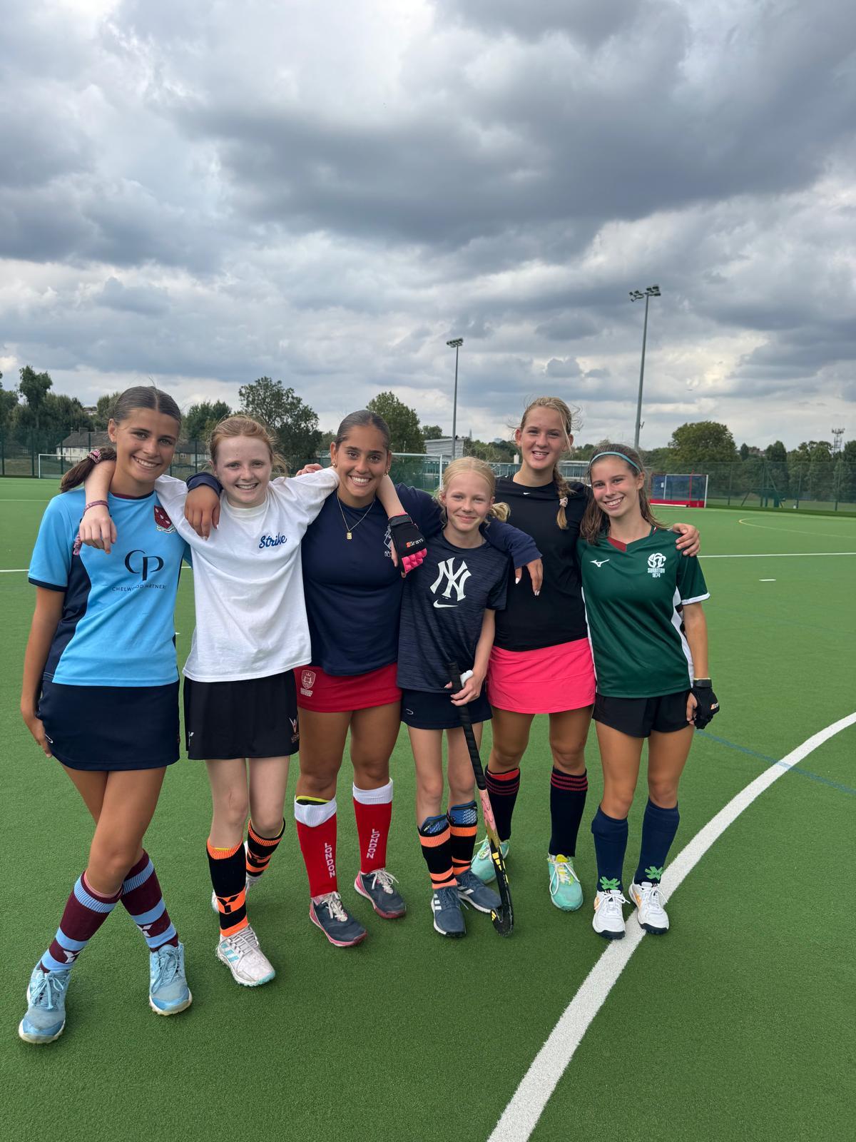 Campers huddled together for a group photo on the pitch